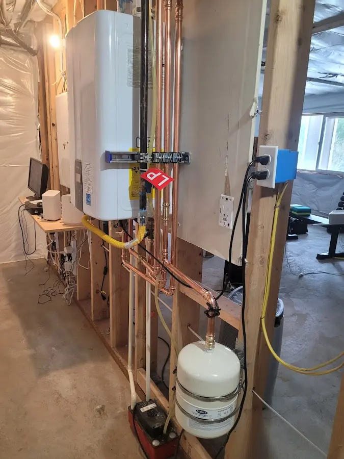Licensed plumber repairing a kitchen sink in Pequannock